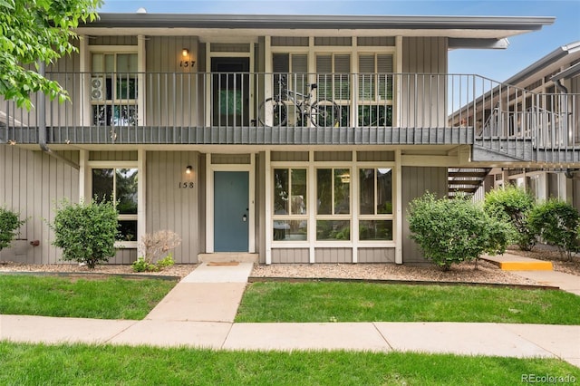 6495 E Happy Canyon Rd Unit 158, Denver, CO 80237 - view of property featuring a balcony and stairway