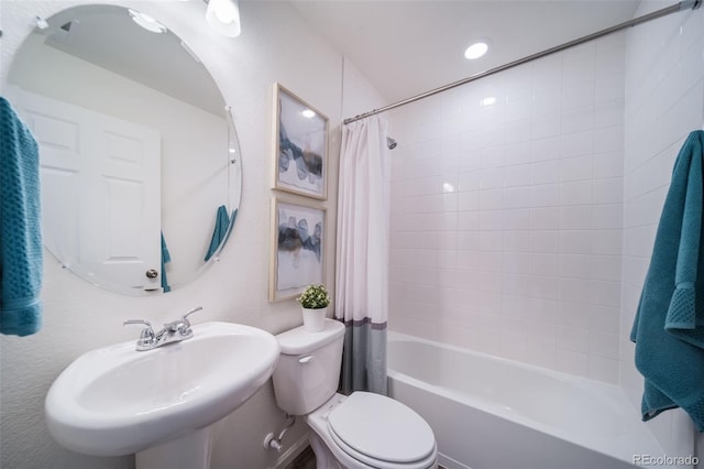 full bathroom with toilet, shower / bath combo, and sink