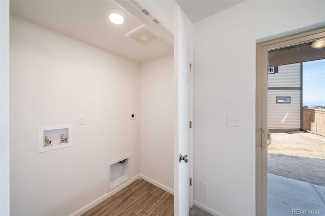 laundry area with hardwood / wood-style flooring, hookup for a washing machine, and electric dryer hookup