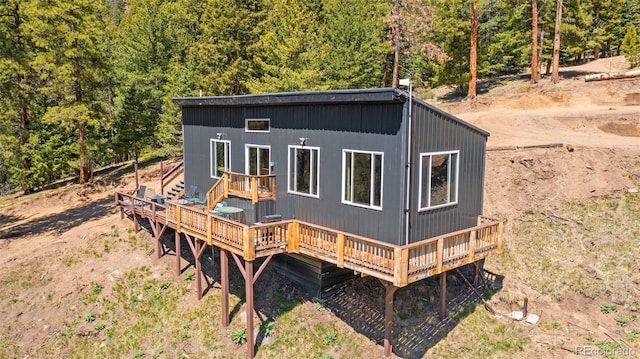 161 Highland Cir, Rye, CO 81069 - rear view of property featuring a deck and a view of trees