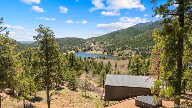 161 Highland Cir, Rye, CO 81069 - view of mountain backdrop featuring a forest and a large body of water