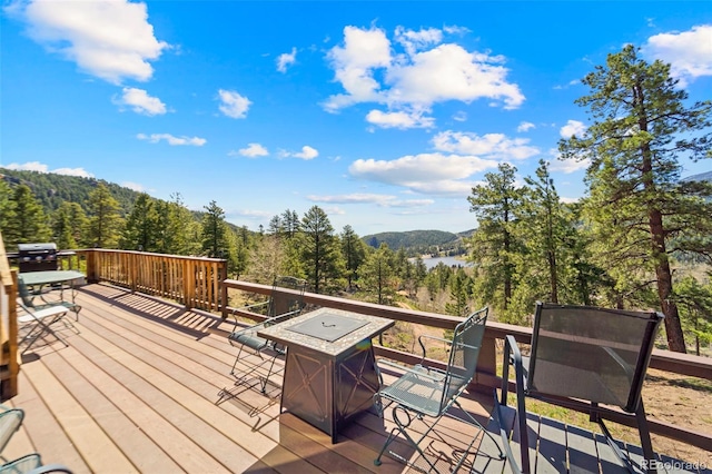 161 Highland Cir, Rye, CO 81069 - wooden terrace featuring a view of trees