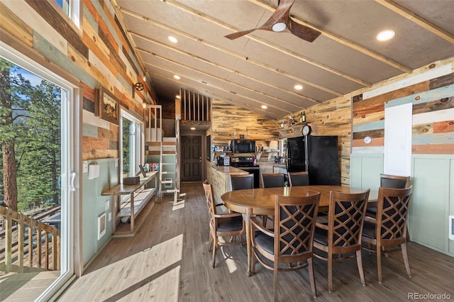 161 Highland Cir, Rye, CO 81069 - dining room featuring lofted ceiling, wood finished floors, wood walls, ceiling fan, and recessed lighting