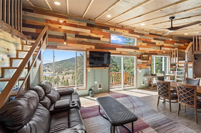 161 Highland Cir, Rye, CO 81069 - living area featuring ceiling fan, stairs, recessed lighting, and wooden walls