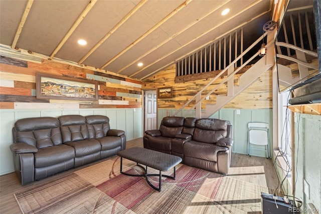 161 Highland Cir, Rye, CO 81069 - living room with wood finished floors, lofted ceiling, wood walls, stairs, and recessed lighting