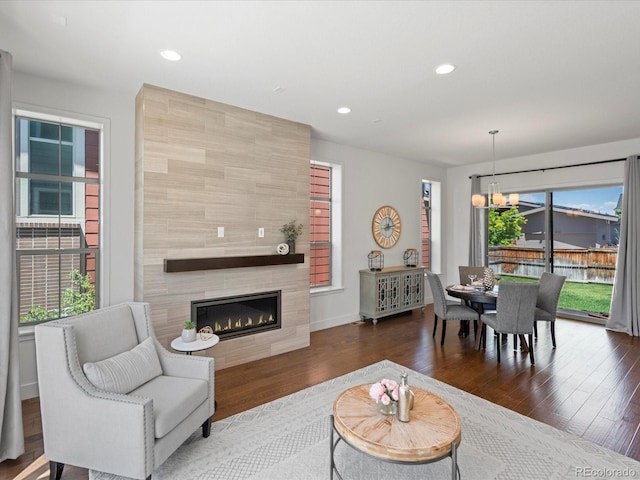10235 E 59th Ave, Denver, CO 80238 - living room with a chandelier, wood finished floors, a fireplace, and recessed lighting