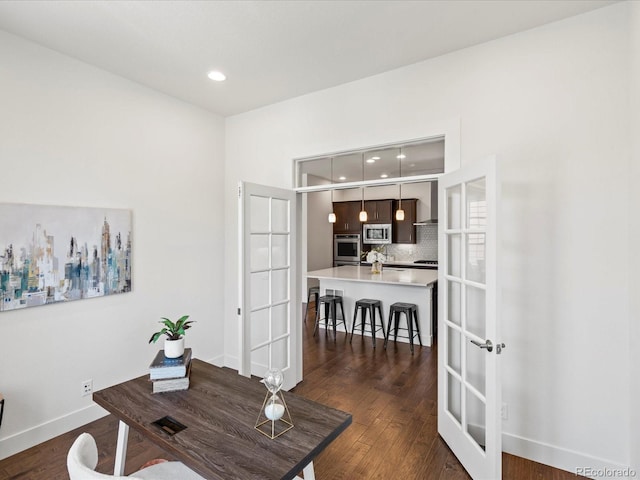 10235 E 59th Ave, Denver, CO 80238 - office featuring dark wood-style flooring, recessed lighting, and french doors