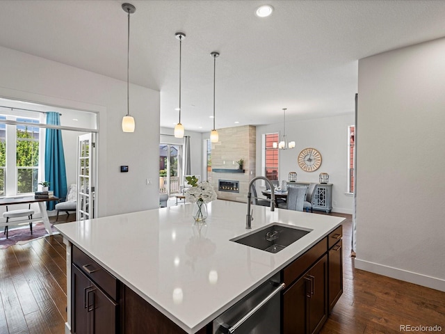 10235 E 59th Ave, Denver, CO 80238 - kitchen with dishwasher, light countertops, dark wood-style floors, plenty of natural light, and recessed lighting