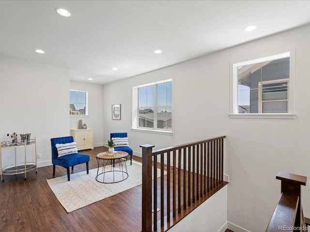 10235 E 59th Ave, Denver, CO 80238 - sitting room featuring wood finished floors, recessed lighting, and an upstairs landing