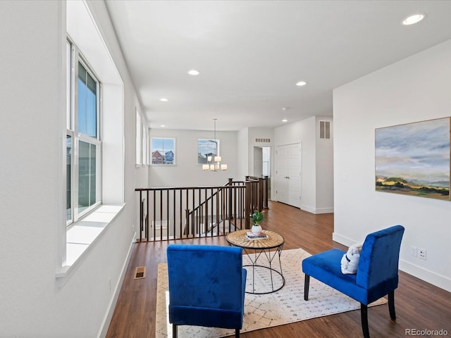 10235 E 59th Ave, Denver, CO 80238 - sitting room featuring a chandelier, wood finished floors, and recessed lighting