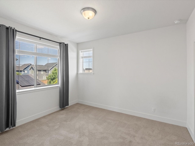 10235 E 59th Ave, Denver, CO 80238 - unfurnished room with light carpet and a smoke detector
