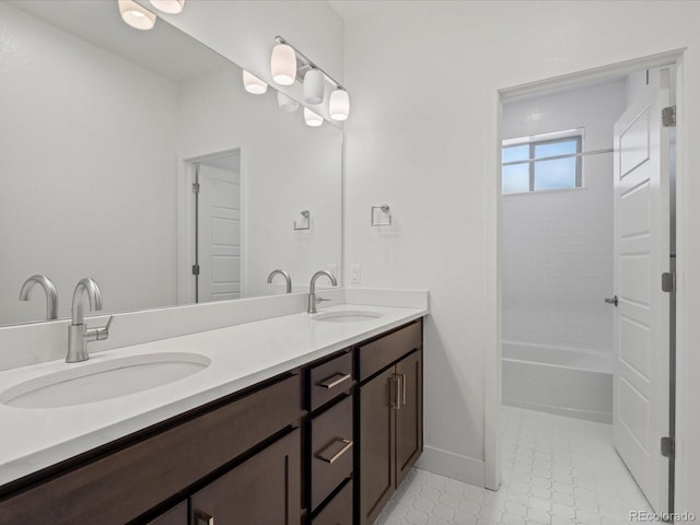 10235 E 59th Ave, Denver, CO 80238 - full bathroom with double vanity, washtub / shower combination, and tile patterned flooring