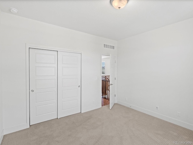 10235 E 59th Ave, Denver, CO 80238 - unfurnished bedroom with carpet floors and a closet