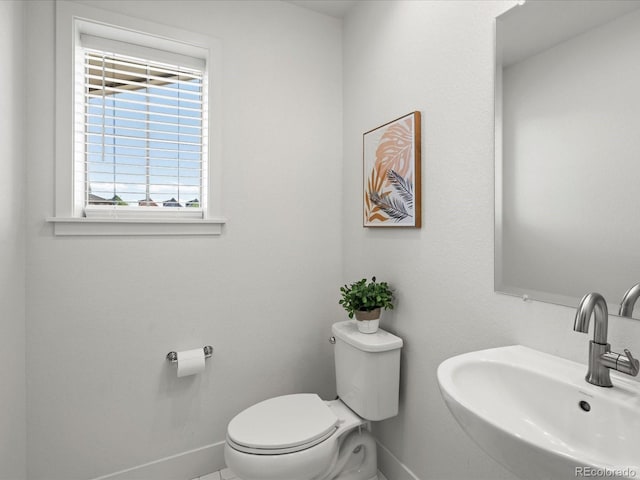 10235 E 59th Ave, Denver, CO 80238 - bathroom featuring toilet and a sink