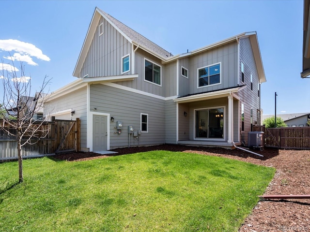 10235 E 59th Ave, Denver, CO 80238 - back of house featuring board and batten siding, a fenced backyard, and a gate