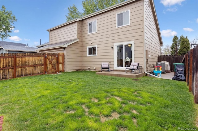 21125 E 43rd Ave, Denver, CO 80249 - back of property featuring a patio and central air condition unit
