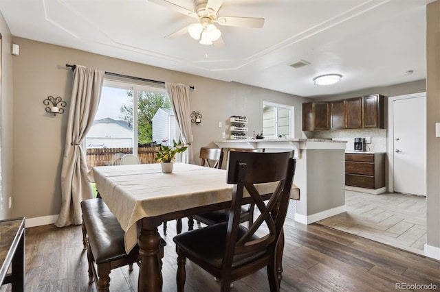 21125 E 43rd Ave, Denver, CO 80249 - dining area featuring a ceiling fan, wood finished floors, and baseboards