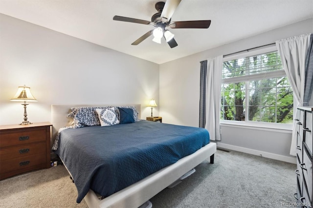 21125 E 43rd Ave, Denver, CO 80249 - bedroom featuring light colored carpet, baseboards, and a ceiling fan