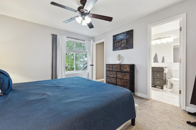 21125 E 43rd Ave, Denver, CO 80249 - bedroom featuring light colored carpet, ensuite bathroom, ceiling fan, and baseboards
