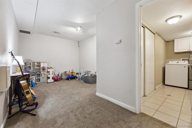 21125 E 43rd Ave, Denver, CO 80249 - recreation room featuring washer / clothes dryer, light colored carpet, and baseboards