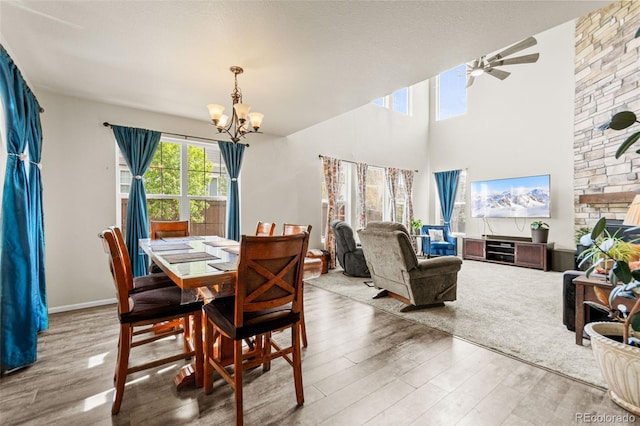 7018 E 123rd Pl, Thornton, CO 80602 - dining room featuring a chandelier, wood finished floors, and ceiling fan