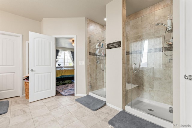 7018 E 123rd Pl, Thornton, CO 80602 - ensuite bathroom with a shower stall, tile patterned flooring, and baseboards