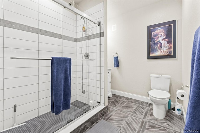 7018 E 123rd Pl, Thornton, CO 80602 - bathroom featuring toilet, a stall shower, and baseboards