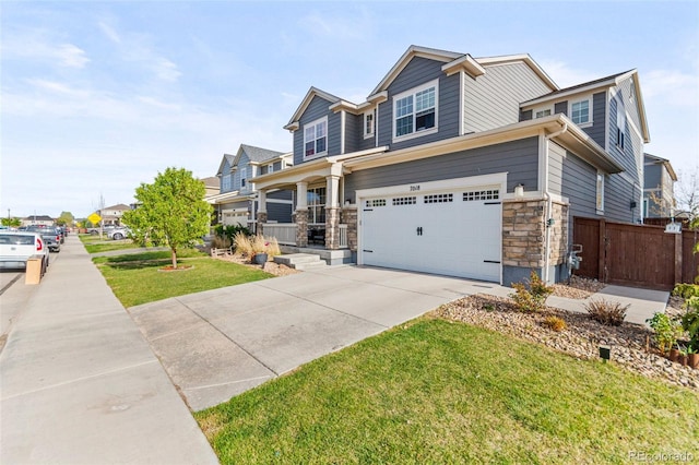 7018 E 123rd Pl, Thornton, CO 80602 - craftsman inspired home featuring concrete driveway, an attached garage, stone siding, and a porch