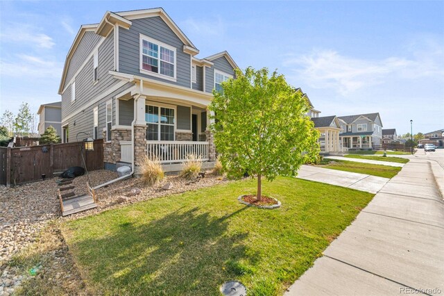 7018 E 123rd Pl, Thornton, CO 80602 - view of front of home with a porch and stone siding