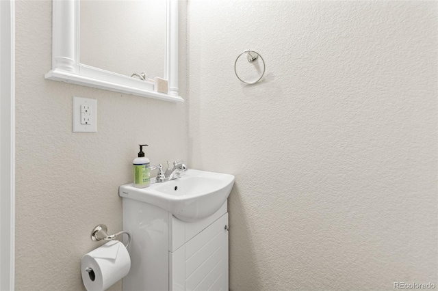 7018 E 123rd Pl, Thornton, CO 80602 - bathroom with vanity and a textured wall