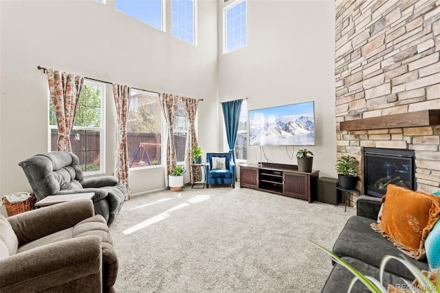 7018 E 123rd Pl, Thornton, CO 80602 - living area with carpet floors, a high ceiling, and a fireplace