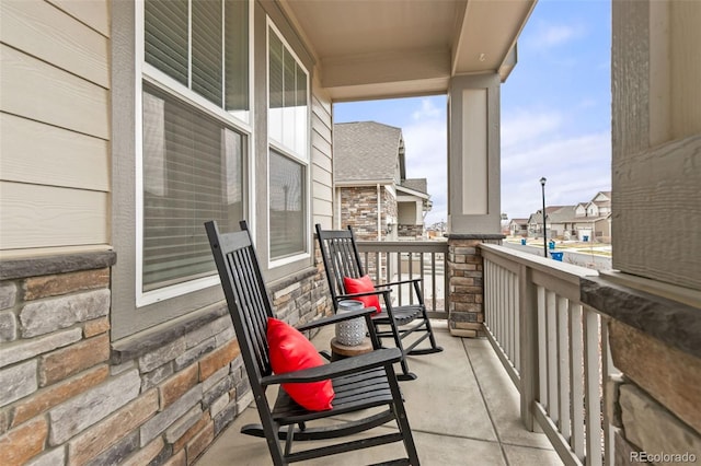 balcony featuring a residential view