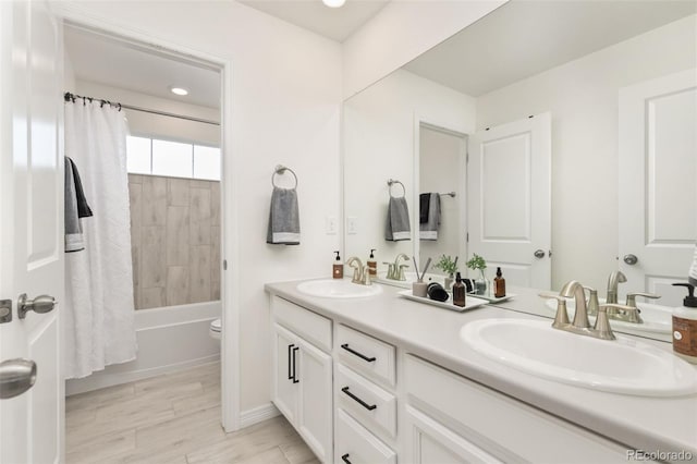 full bathroom featuring double vanity, a sink, and shower / bathtub combination with curtain