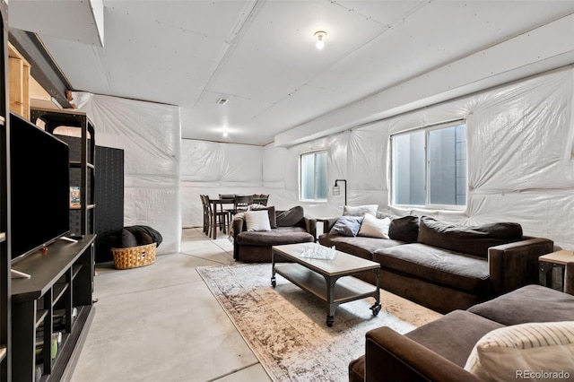 living area with concrete floors