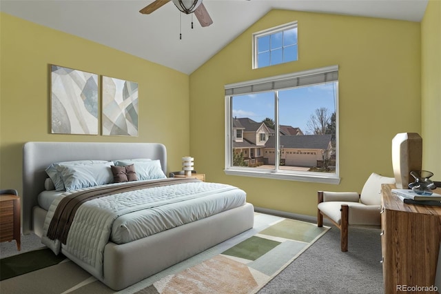 carpeted bedroom with a ceiling fan and high vaulted ceiling