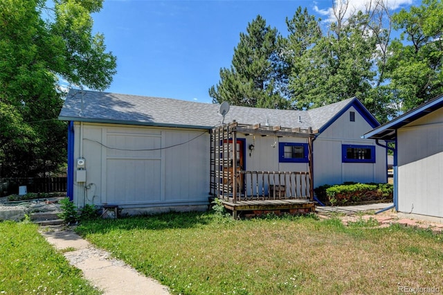 6788 Pierce Way, Arvada, CO 80003 - view of front of house featuring a front yard, roof with shingles, and a pergola