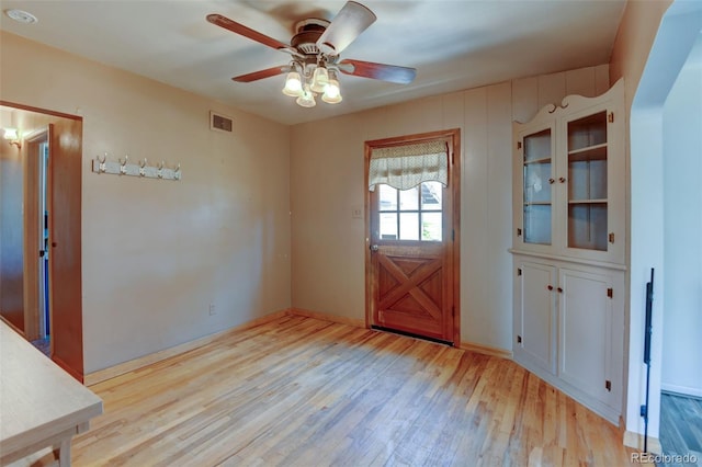 6788 Pierce Way, Arvada, CO 80003 - doorway featuring light wood-style flooring and a ceiling fan