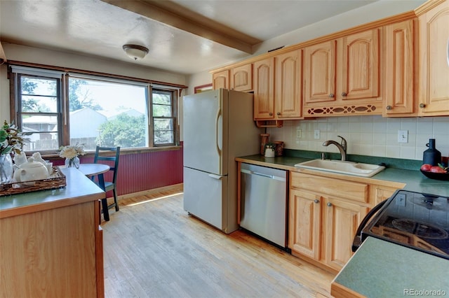 6788 Pierce Way, Arvada, CO 80003 - kitchen with stainless steel dishwasher, light brown cabinets, freestanding refrigerator, light wood-style floors, and beam ceiling