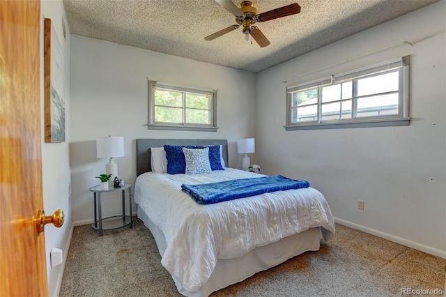 6788 Pierce Way, Arvada, CO 80003 - bedroom with multiple windows, a textured ceiling, carpet, and a ceiling fan