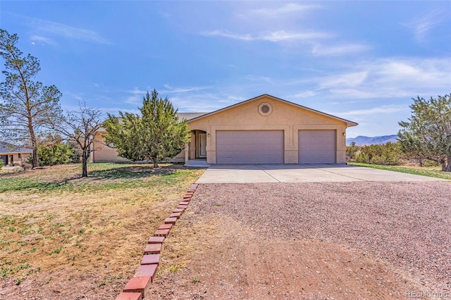 1041 Rockafellow Ct, Canon City, CO 81212 - ranch-style house with a front lawn and stucco siding