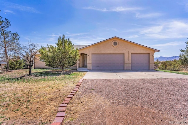 1041 Rockafellow Ct, Canon City, CO 81212 - ranch-style home featuring a garage and stucco siding