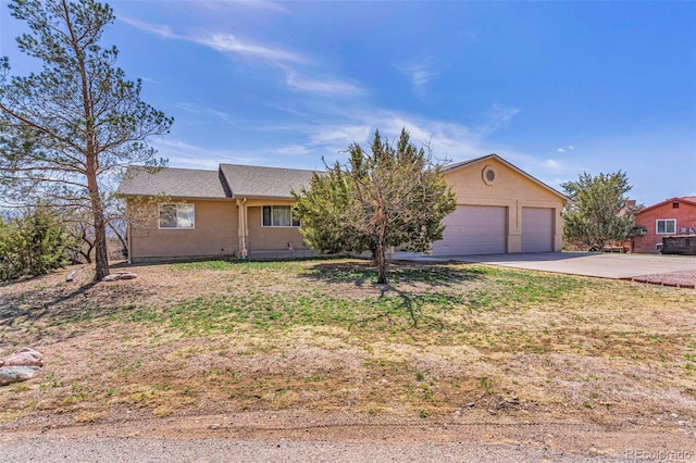 1041 Rockafellow Ct, Canon City, CO 81212 - ranch-style home featuring an attached garage and driveway