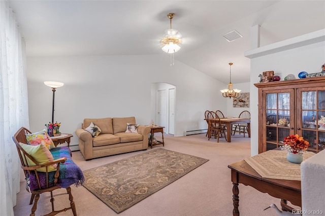 1041 Rockafellow Ct, Canon City, CO 81212 - living room featuring light carpet, baseboard heating, arched walkways, ceiling fan with notable chandelier, and vaulted ceiling