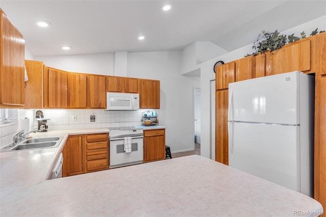 1041 Rockafellow Ct, Canon City, CO 81212 - kitchen featuring a sink, white appliances, light countertops, decorative backsplash, and vaulted ceiling