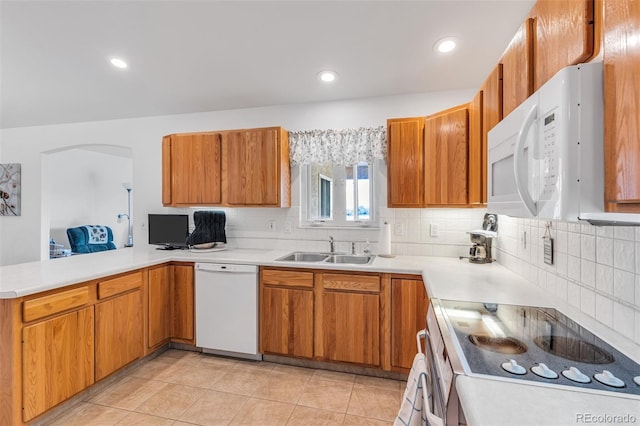1041 Rockafellow Ct, Canon City, CO 81212 - kitchen featuring white appliances, light countertops, a sink, and tasteful backsplash