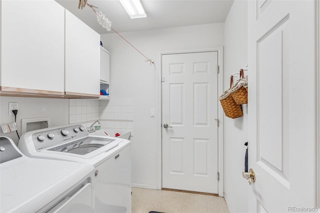 1041 Rockafellow Ct, Canon City, CO 81212 - clothes washing area featuring baseboards, cabinet space, light floors, and washing machine and clothes dryer