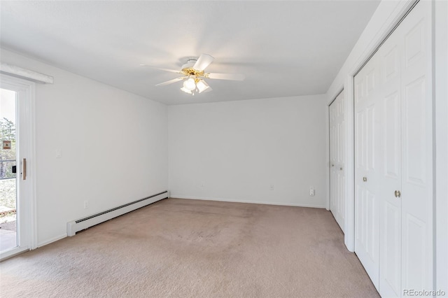 1041 Rockafellow Ct, Canon City, CO 81212 - unfurnished bedroom featuring a ceiling fan, multiple windows, carpet, and a baseboard radiator
