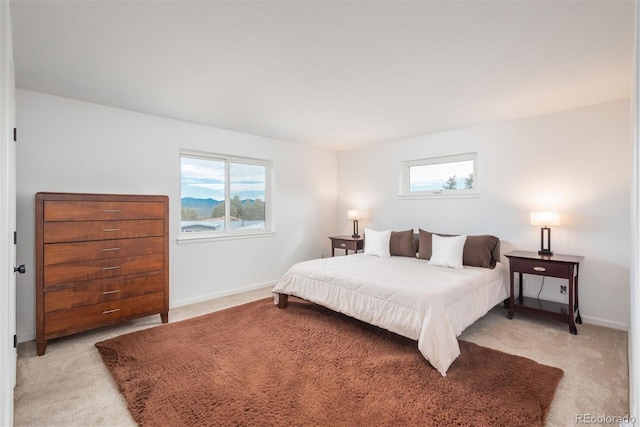 28364 Tresine Dr, Evergreen, CO 80439 - bedroom with multiple windows and light colored carpet