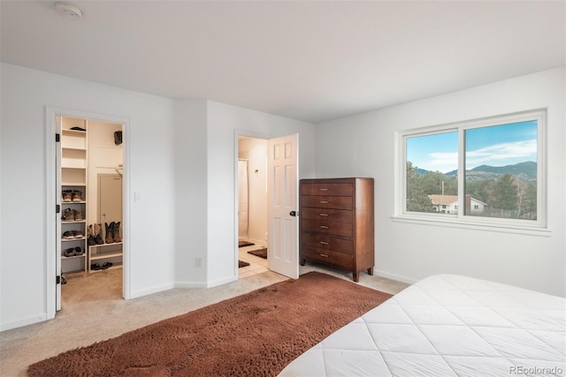 28364 Tresine Dr, Evergreen, CO 80439 - carpeted bedroom with a walk in closet and connected bathroom