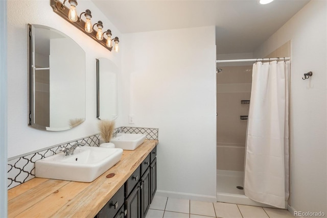 28364 Tresine Dr, Evergreen, CO 80439 - full bath featuring double vanity, tile patterned flooring, and a tile shower